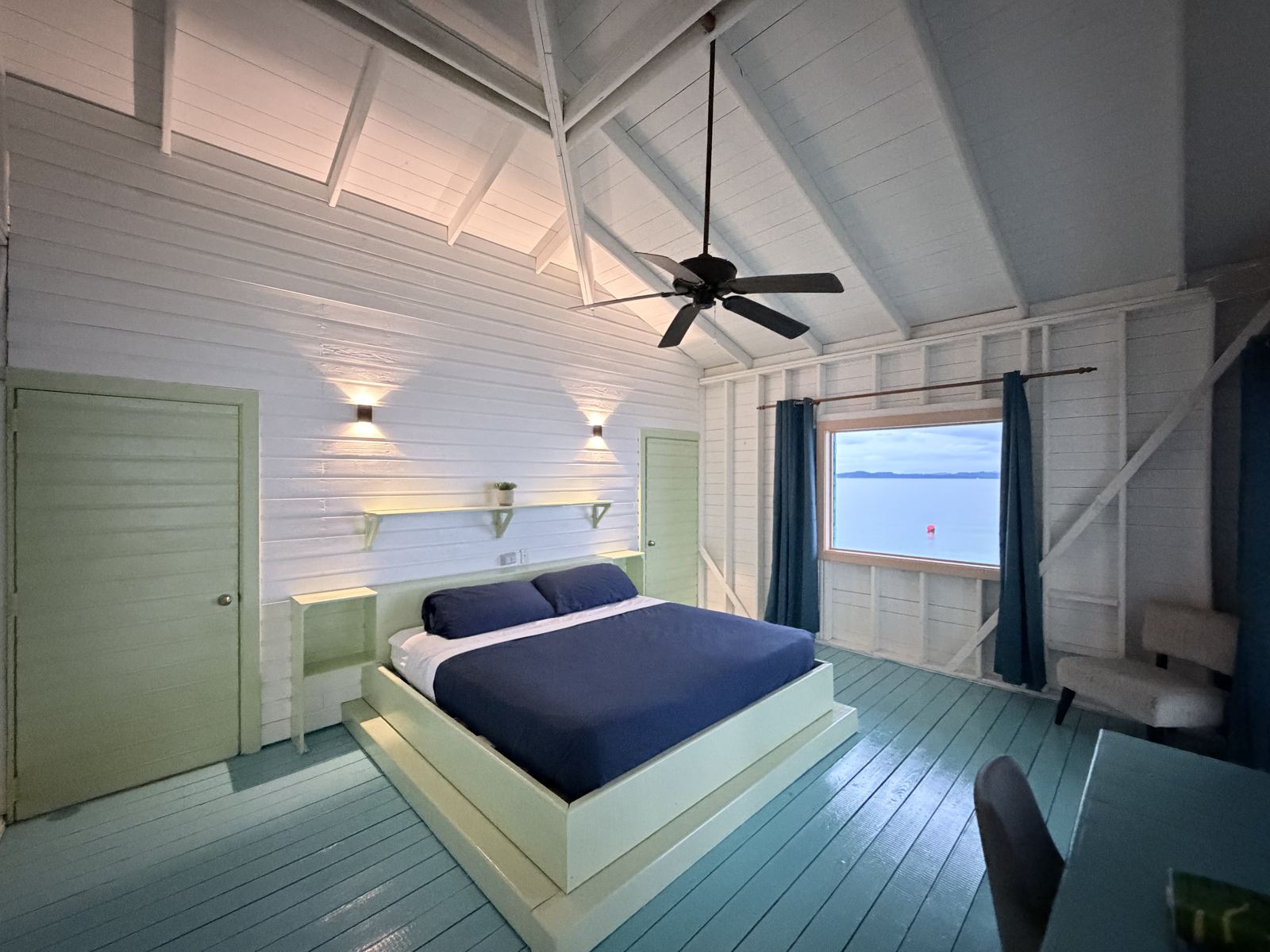 Bedroom at Casa Clearwater with a king bed and ceiling fan